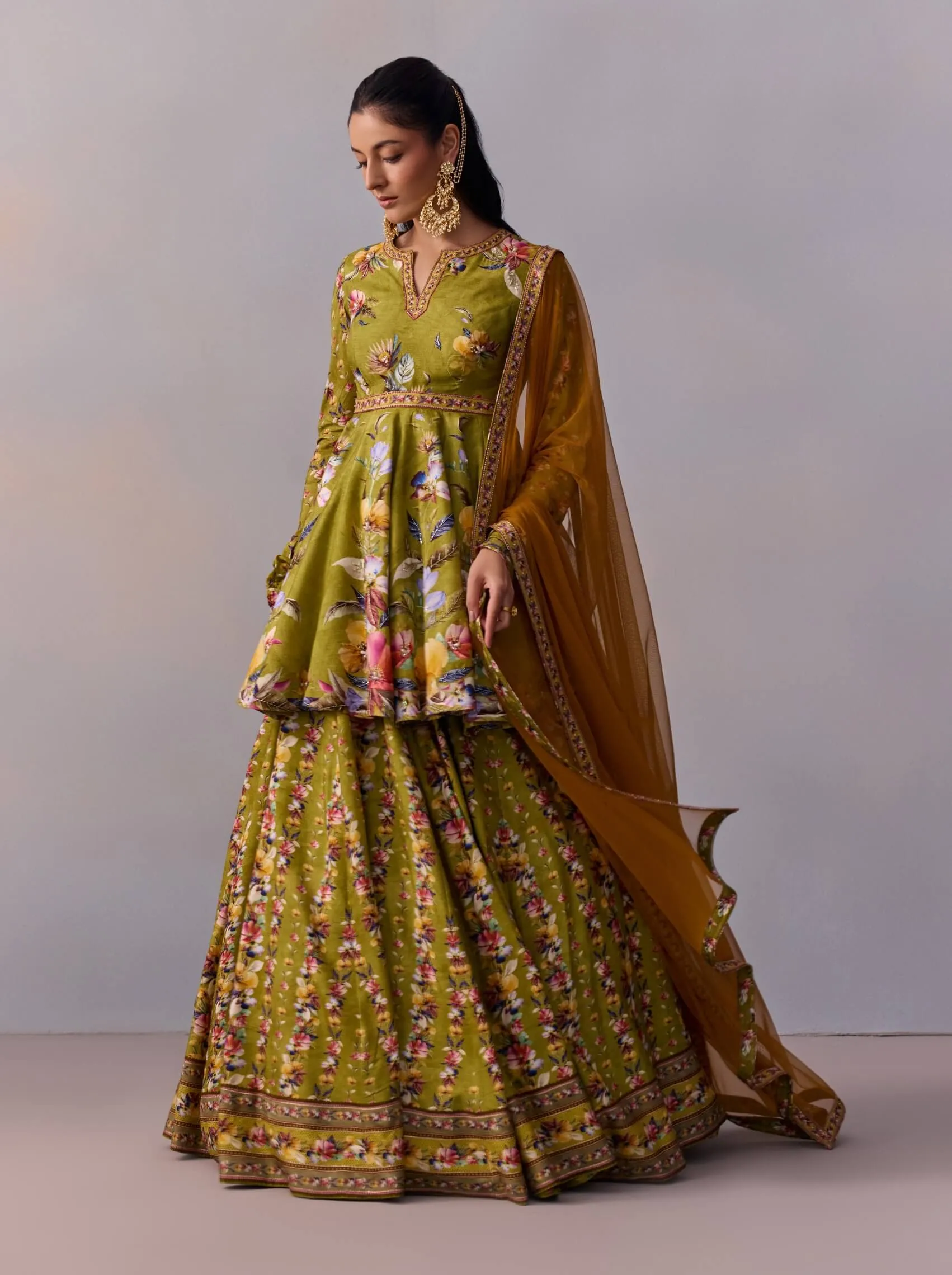 Taisha olive green peplum and lehenga set